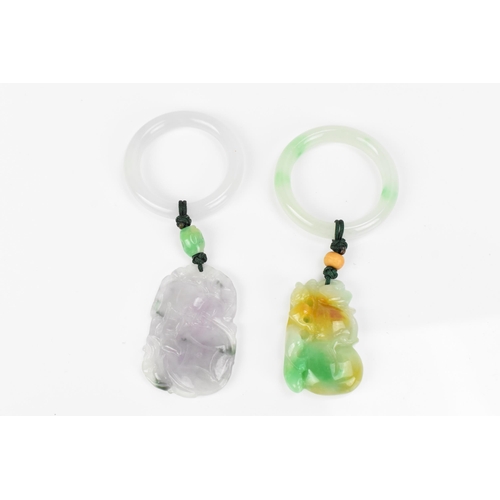 93 - Two Chinese modern jade pendants, one with pierced mottled green fruit pendant hanging on the hoop, ... 