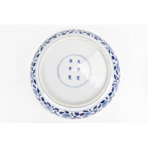 94 - A Chinese blue and white porcelain dish, Qing dynasty style, of circular form, with underglazed blue... 