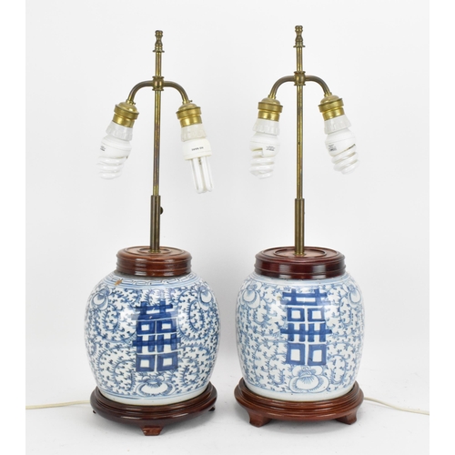 96 - A near pair of Chinese blue and white porcelain double happiness ginger jars, late 19th century, con... 