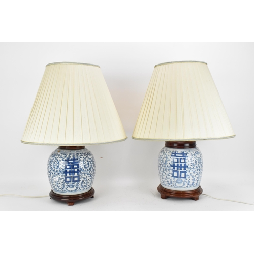 96 - A near pair of Chinese blue and white porcelain double happiness ginger jars, late 19th century, con... 