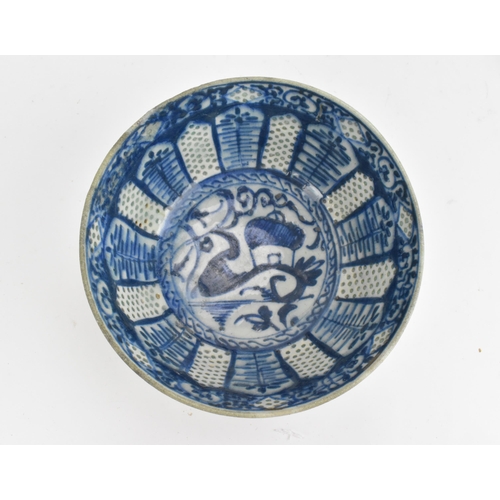 99 - An early Middle Eastern blue and white stonepaste bowl, possibly 14th century Syrian or Iranian, mam... 