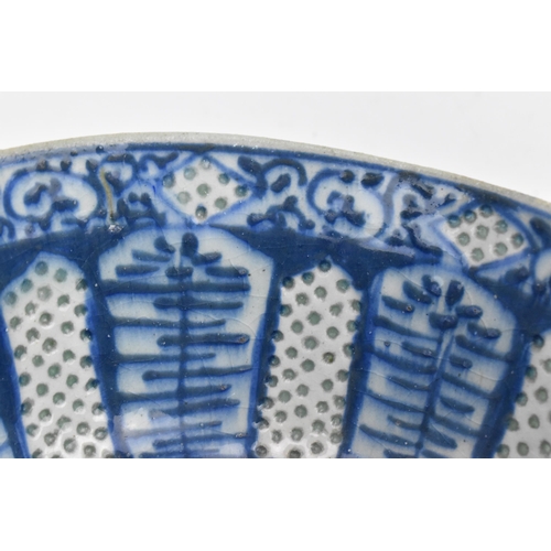 99 - An early Middle Eastern blue and white stonepaste bowl, possibly 14th century Syrian or Iranian, mam... 