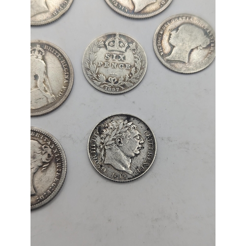 19 - A collection of Georgian and Victorian British coinage to include a George III 1819 Sixpence, mixed ... 