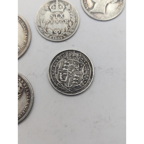 19 - A collection of Georgian and Victorian British coinage to include a George III 1819 Sixpence, mixed ... 