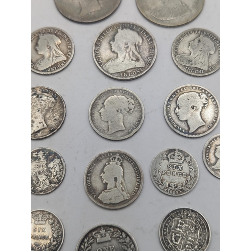 19 - A collection of Georgian and Victorian British coinage to include a George III 1819 Sixpence, mixed ... 