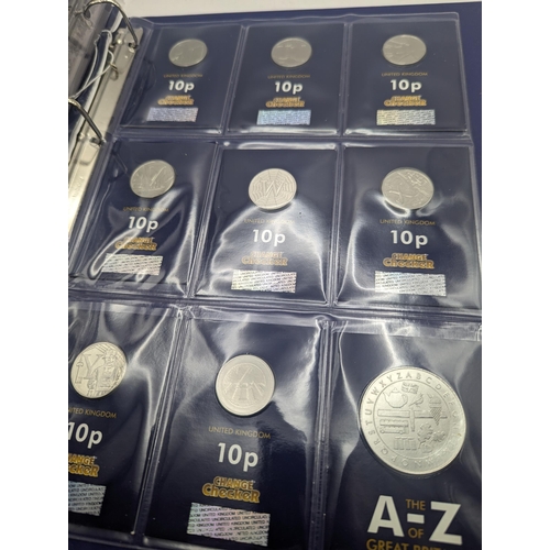 23 - An A-Z of Great Britain 10p collection, comprising of 16 10 pence along with the A-Z commemorative h... 