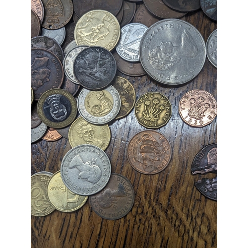 24 - A quantity of British and world coinage to include George III halfpenny, Cartwheel penny A/F, Leopol... 