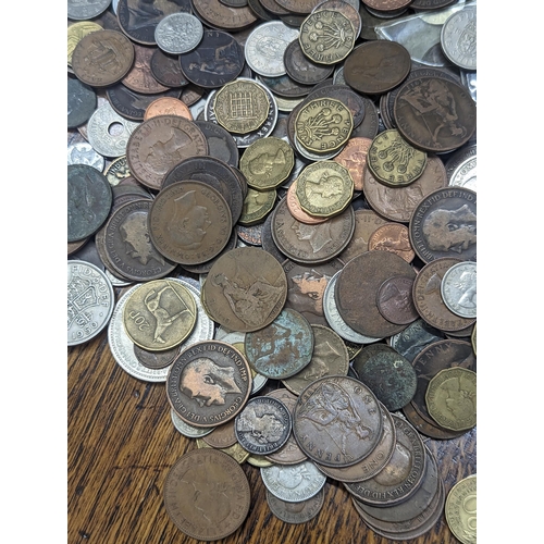 24 - A quantity of British and world coinage to include George III halfpenny, Cartwheel penny A/F, Leopol... 