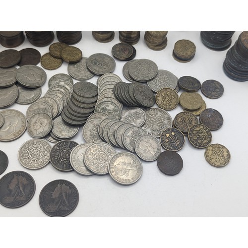 20 - A quantity of pre decimal British coinage to include Victorian and later pennies, George VI two Shil... 