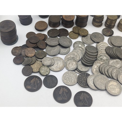 20 - A quantity of pre decimal British coinage to include Victorian and later pennies, George VI two Shil... 