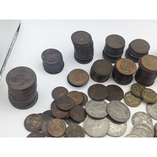 20 - A quantity of pre decimal British coinage to include Victorian and later pennies, George VI two Shil... 