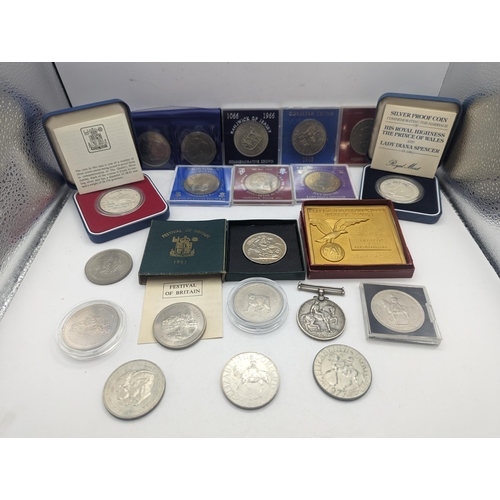 39 - A mixed collection of coins to include a silver Proof Silver Jubilee and  Charles and Diana Crowns, ... 