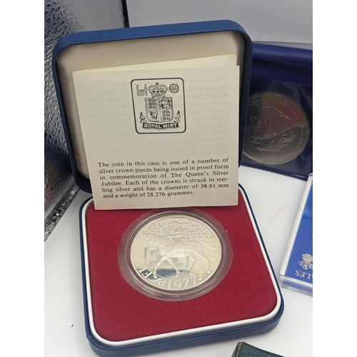 39 - A mixed collection of coins to include a silver Proof Silver Jubilee and  Charles and Diana Crowns, ... 