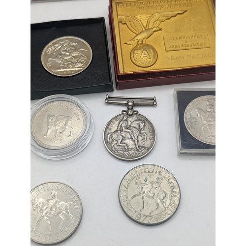 39 - A mixed collection of coins to include a silver Proof Silver Jubilee and  Charles and Diana Crowns, ... 