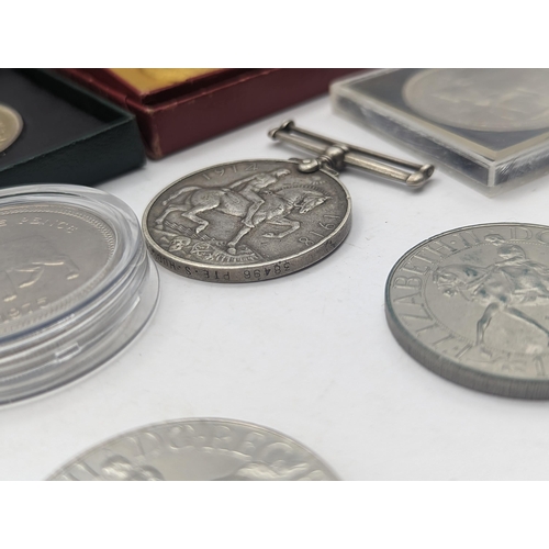 39 - A mixed collection of coins to include a silver Proof Silver Jubilee and  Charles and Diana Crowns, ... 