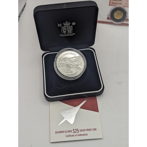 6 - A group of three Concorde commemorative coins to include the 502 silver proof 2003 Alderney £10, the... 