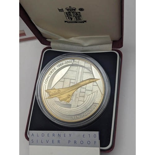 6 - A group of three Concorde commemorative coins to include the 502 silver proof 2003 Alderney £10, the... 