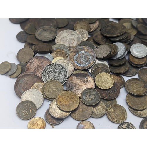 63 - A mixed British and world coins to include George V Shillings, mixed pennies and later examples, Fre... 