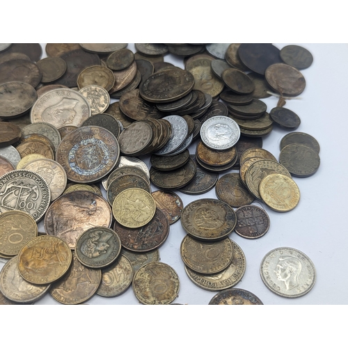 63 - A mixed British and world coins to include George V Shillings, mixed pennies and later examples, Fre... 