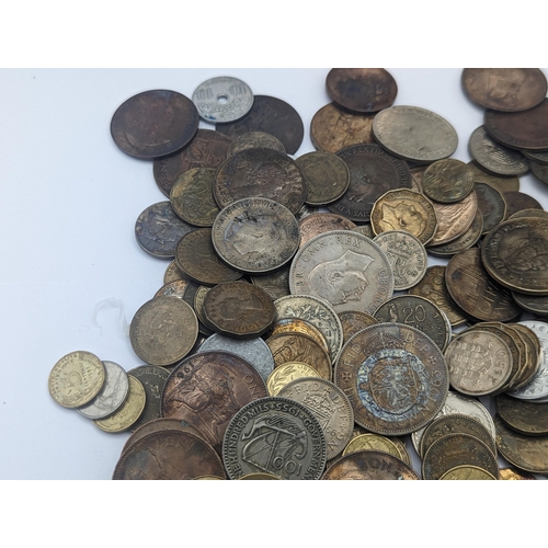 63 - A mixed British and world coins to include George V Shillings, mixed pennies and later examples, Fre... 