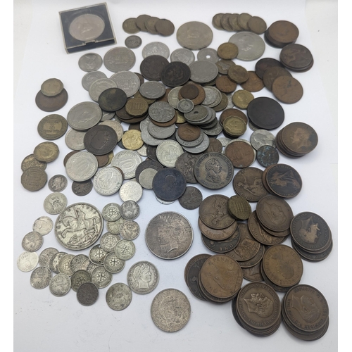 64 - A mixed collection of world coins to include a 1924 'Eagle' Dollar and later USA coins to include 19... 