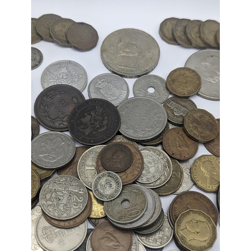 64 - A mixed collection of world coins to include a 1924 'Eagle' Dollar and later USA coins to include 19... 