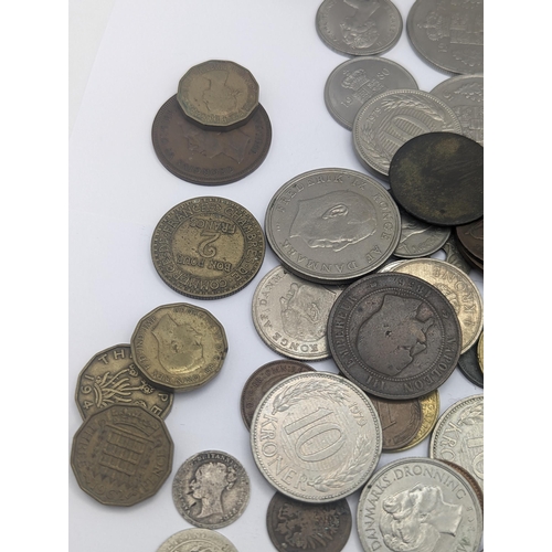 64 - A mixed collection of world coins to include a 1924 'Eagle' Dollar and later USA coins to include 19... 