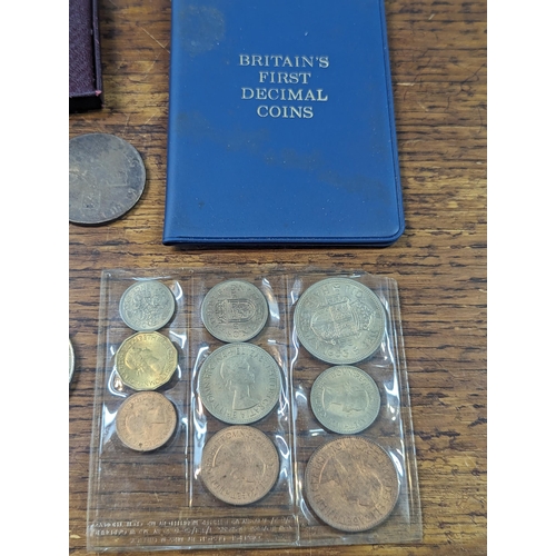 68 - A mixed collection of coins to include a William III crown, Victoria 1892 Crown, along with later co... 