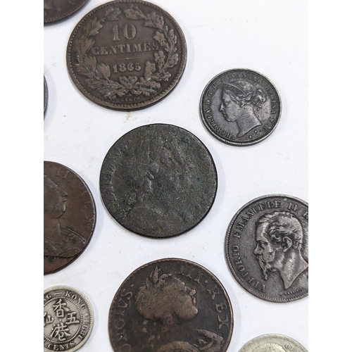 9 - A mixed collection of world coins to include William and Mary halfpenny, 1822 Irish halfpenny, 1822 ... 