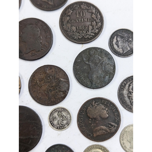 9 - A mixed collection of world coins to include William and Mary halfpenny, 1822 Irish halfpenny, 1822 ... 