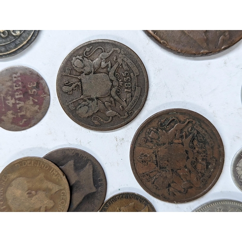 9 - A mixed collection of world coins to include William and Mary halfpenny, 1822 Irish halfpenny, 1822 ... 