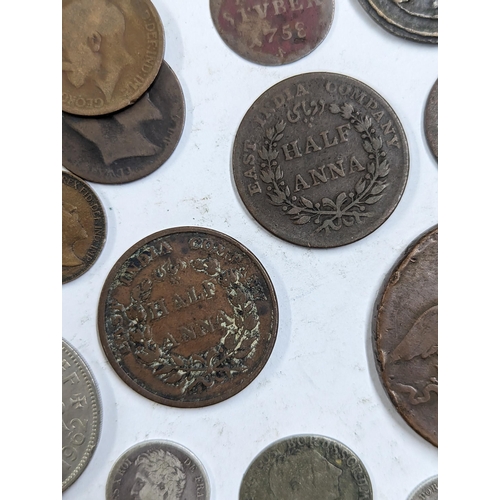 9 - A mixed collection of world coins to include William and Mary halfpenny, 1822 Irish halfpenny, 1822 ... 