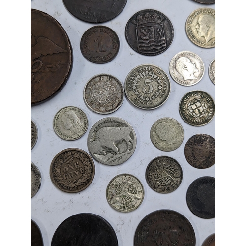 9 - A mixed collection of world coins to include William and Mary halfpenny, 1822 Irish halfpenny, 1822 ... 