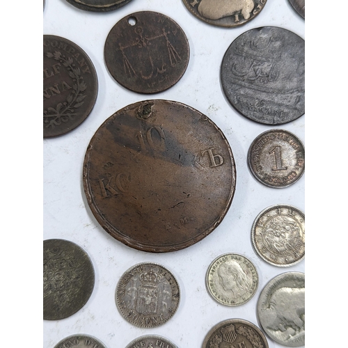 9 - A mixed collection of world coins to include William and Mary halfpenny, 1822 Irish halfpenny, 1822 ... 