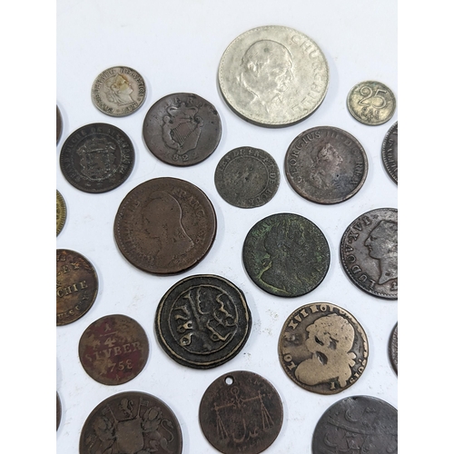 9 - A mixed collection of world coins to include William and Mary halfpenny, 1822 Irish halfpenny, 1822 ... 