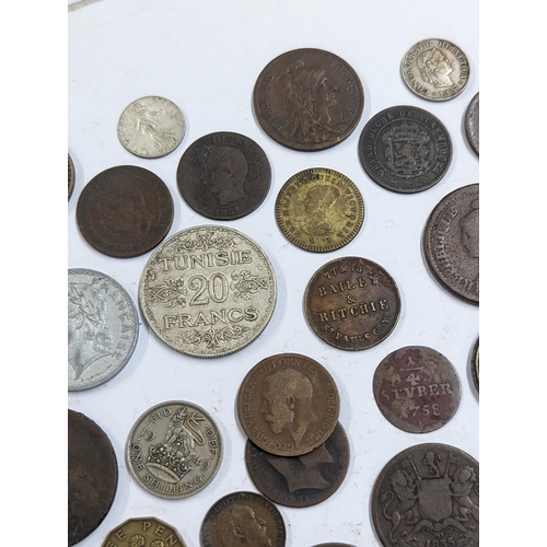 9 - A mixed collection of world coins to include William and Mary halfpenny, 1822 Irish halfpenny, 1822 ... 