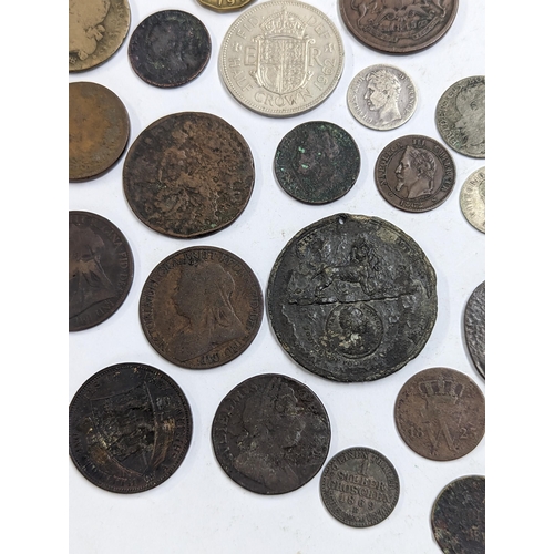 9 - A mixed collection of world coins to include William and Mary halfpenny, 1822 Irish halfpenny, 1822 ... 