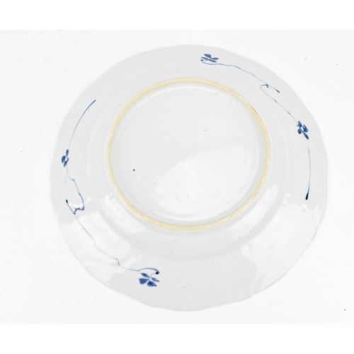 107 - A Chinese blue and white porcelain charger, early 18th century, Kangxi period, with central naturali... 