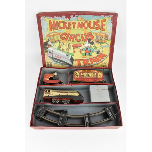 214 - A 1930s Wells Brimtoy Disney Mickey Mouse Circus Train set, with tinplate clockwork 0-4-0 loco in bl... 