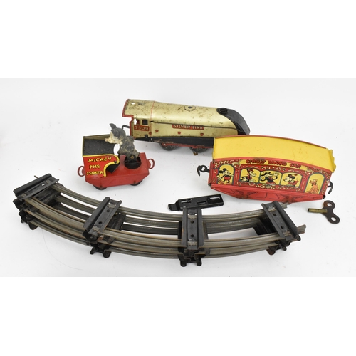 214 - A 1930s Wells Brimtoy Disney Mickey Mouse Circus Train set, with tinplate clockwork 0-4-0 loco in bl... 