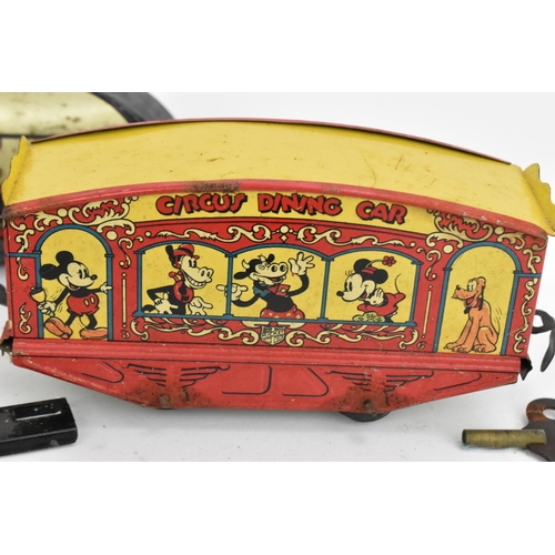 214 - A 1930s Wells Brimtoy Disney Mickey Mouse Circus Train set, with tinplate clockwork 0-4-0 loco in bl... 