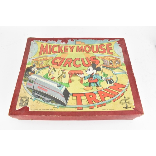 214 - A 1930s Wells Brimtoy Disney Mickey Mouse Circus Train set, with tinplate clockwork 0-4-0 loco in bl... 