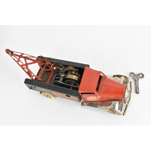 215 - A 1930s Tri-ang Minic tinplate clockwork Breakdown Lorry, in red and black, with winding key, in ori... 