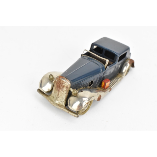 216 - A Tri-ang Minic tinplate clockwork Daimler Sedanca, in blue and steel colour, with original box and ... 