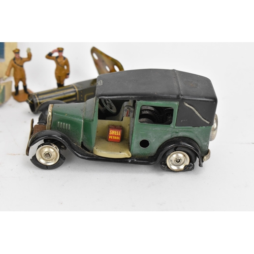 217 - A Tri-Ang Minic clockwork tinplate Taxi, green body, black roof and chassis, white tyres, with petro... 