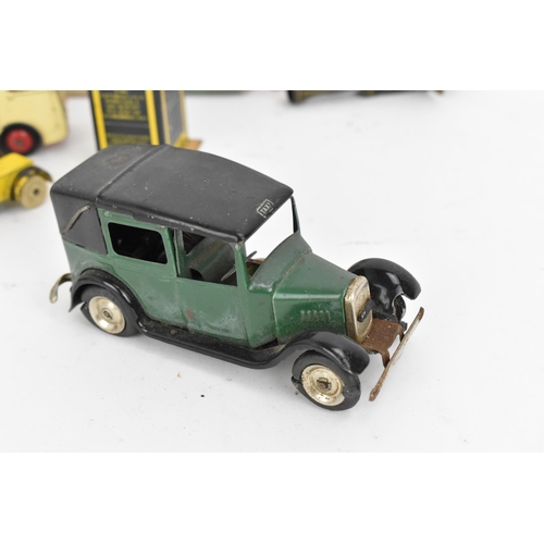 217 - A Tri-Ang Minic clockwork tinplate Taxi, green body, black roof and chassis, white tyres, with petro... 