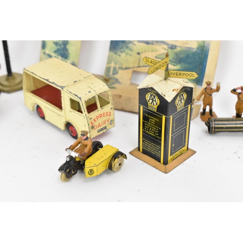 217 - A Tri-Ang Minic clockwork tinplate Taxi, green body, black roof and chassis, white tyres, with petro... 