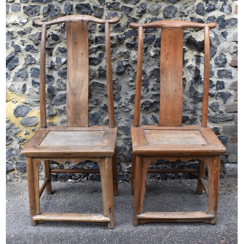 105 - A pair of Chinese yoke-back scholar chairs, possibly made from huanghuali wood, 18th century or earl... 