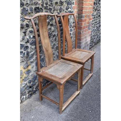 105 - A pair of Chinese yoke-back scholar chairs, possibly made from huanghuali wood, 18th century or earl... 