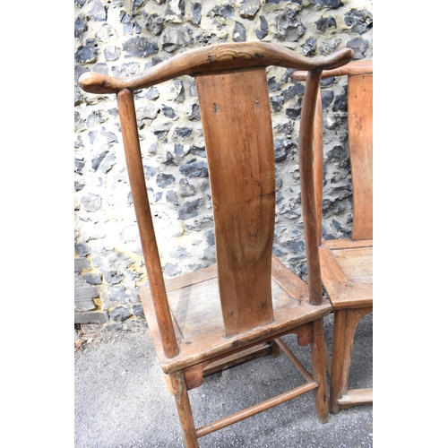 105 - A pair of Chinese yoke-back scholar chairs, possibly made from huanghuali wood, 18th century or earl... 